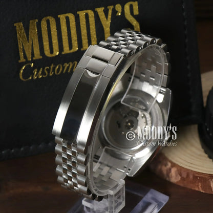 Silver wristwatch with metal band featuring Seiko Mod Datejust and Ice Blue Roman dial