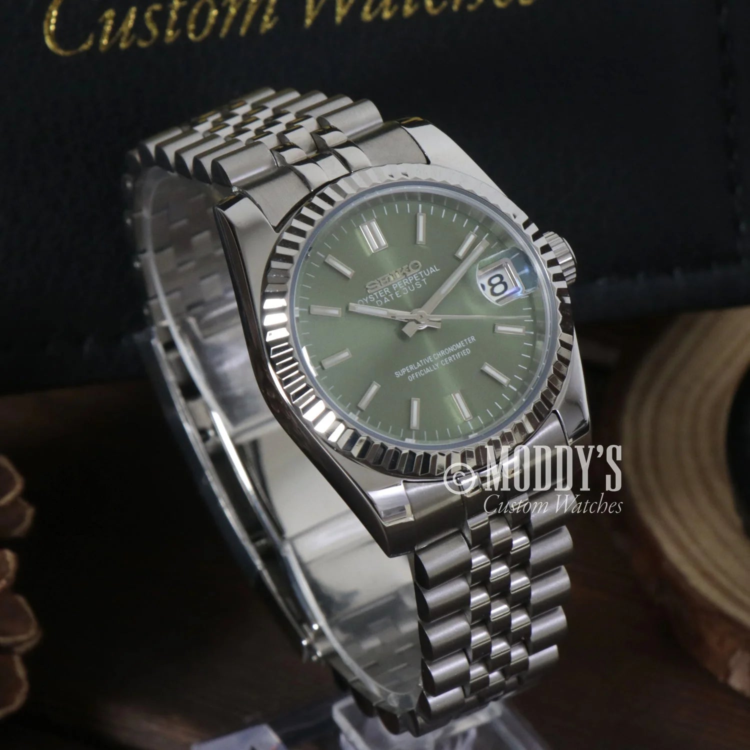 Stainless steel Rolex Datejust with green dial and fluted bezel in Seiko Mod style