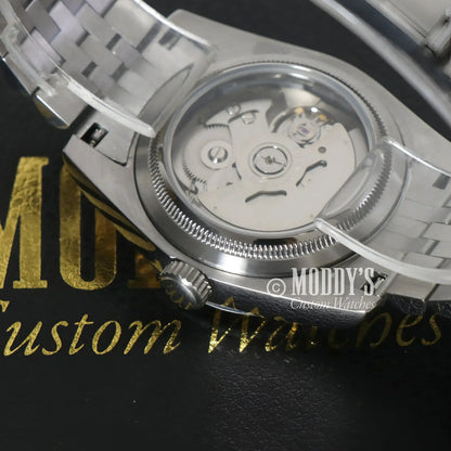 Silver wristwatch with visible NH35 automatic movement, Seiko Mod Datejust, Royal Green Arabic