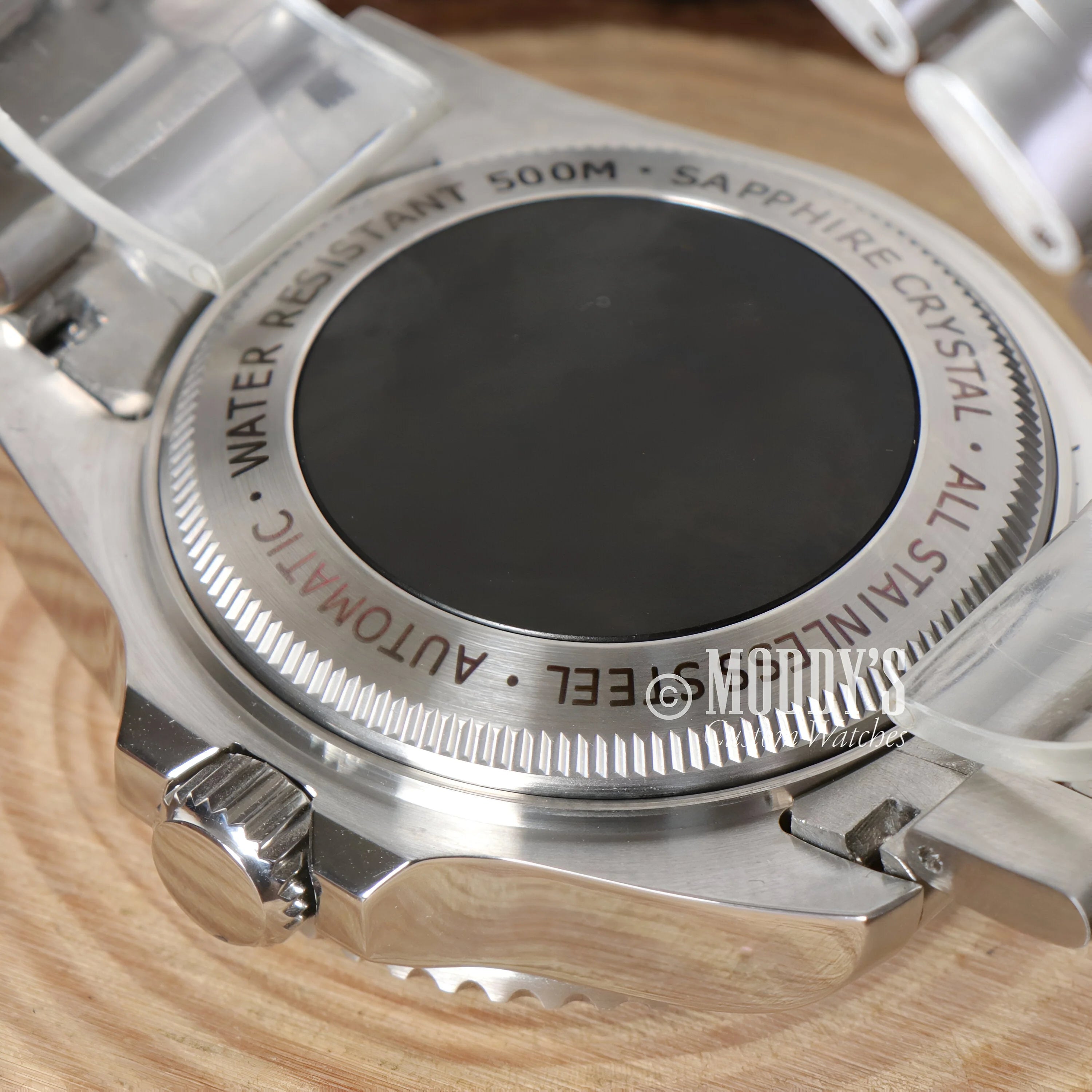 Circular metallic watch case back of Seikomariner Deepsea with NH35 automatic movement