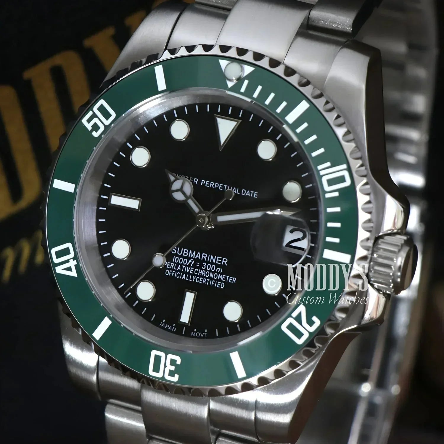 Silver and green Submariner watch from Seikomariner, a stylish Seiko mod with NH35 automatic