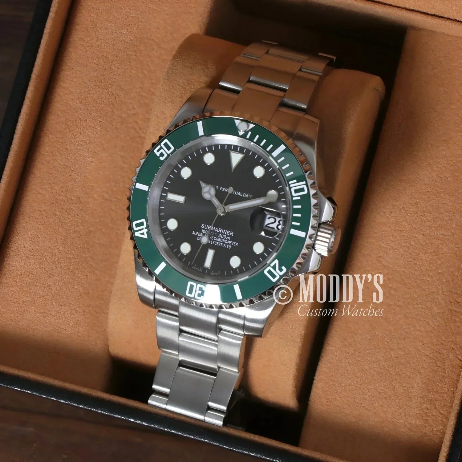 Silver wristwatch with green bezel from Seikomariner Kermit, featuring Seiko NH35 automatic