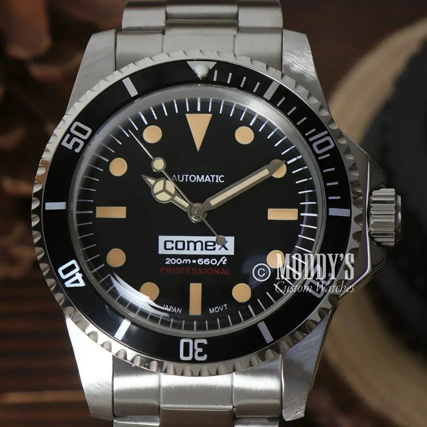 Silver and black diver’s watch from Seikomariner Vintage featuring Seiko NH35 automatic