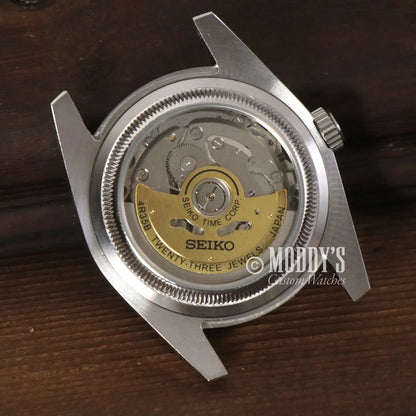 Open-backed Seiko watch mechanism in Premium Rotor x1 showcasing Seiko movements