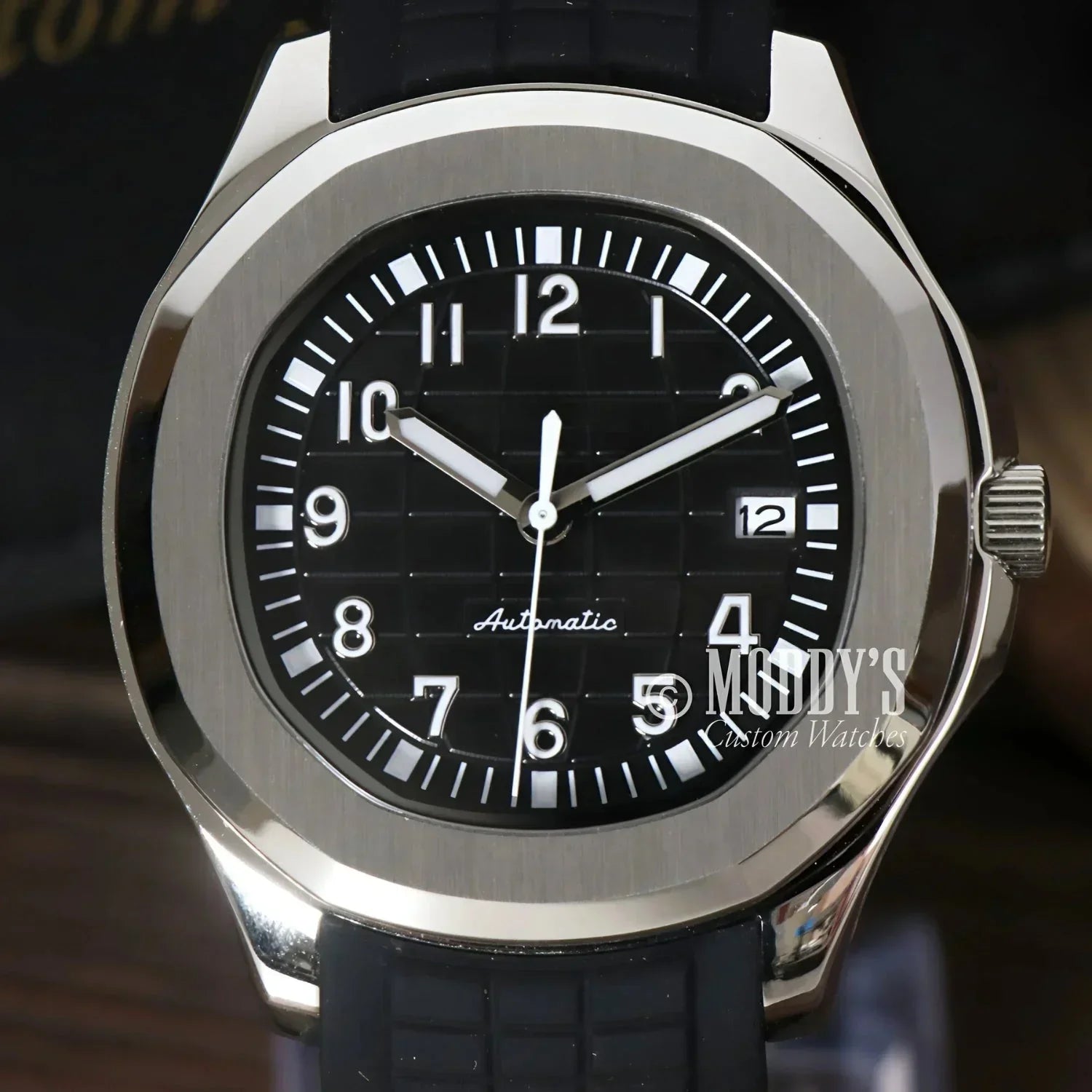 Silver-cased wristwatch with black band featuring Seiko NH35 automatic movement