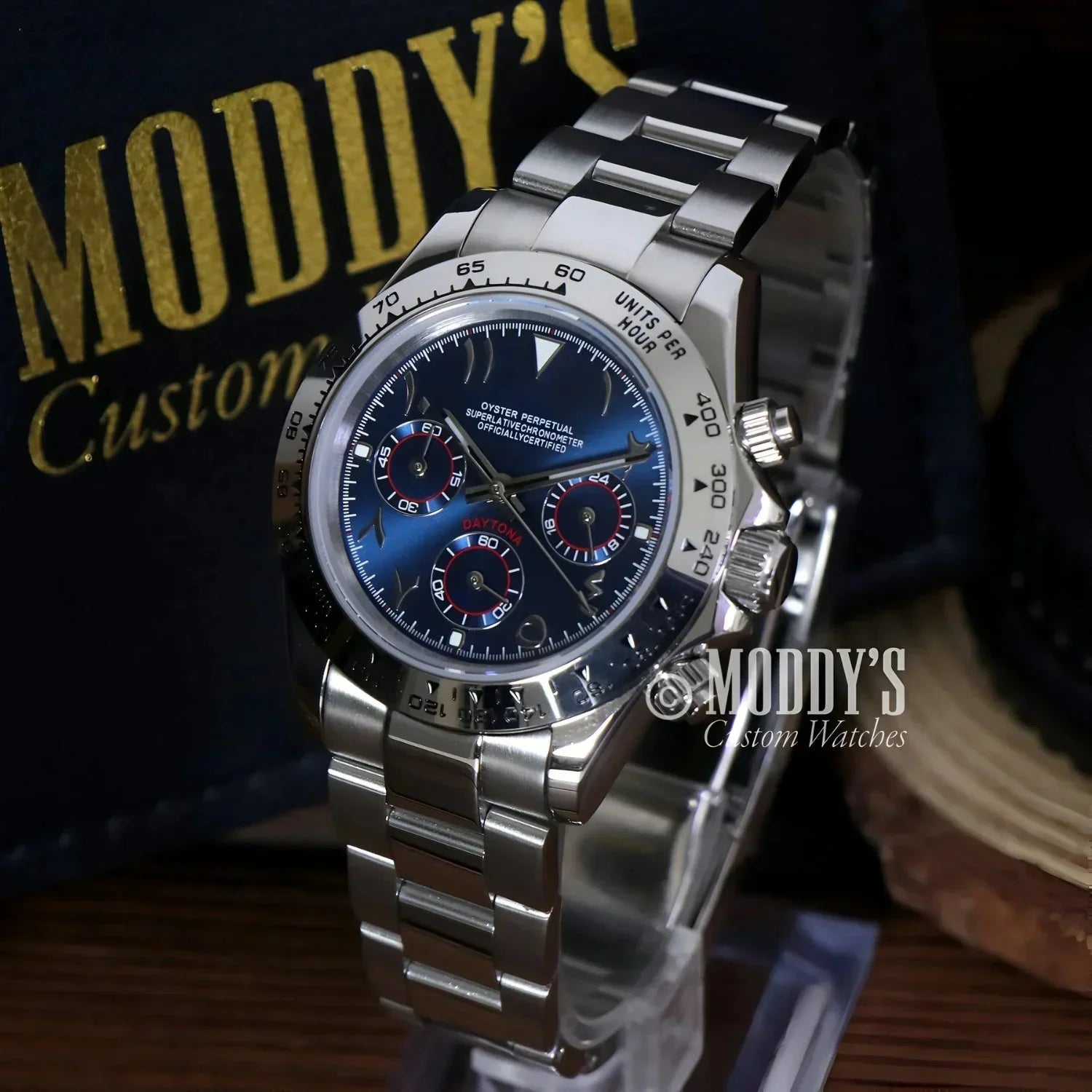 Silver chronograph wristwatch with blue dial featuring Seiko VK63 hybrid movement