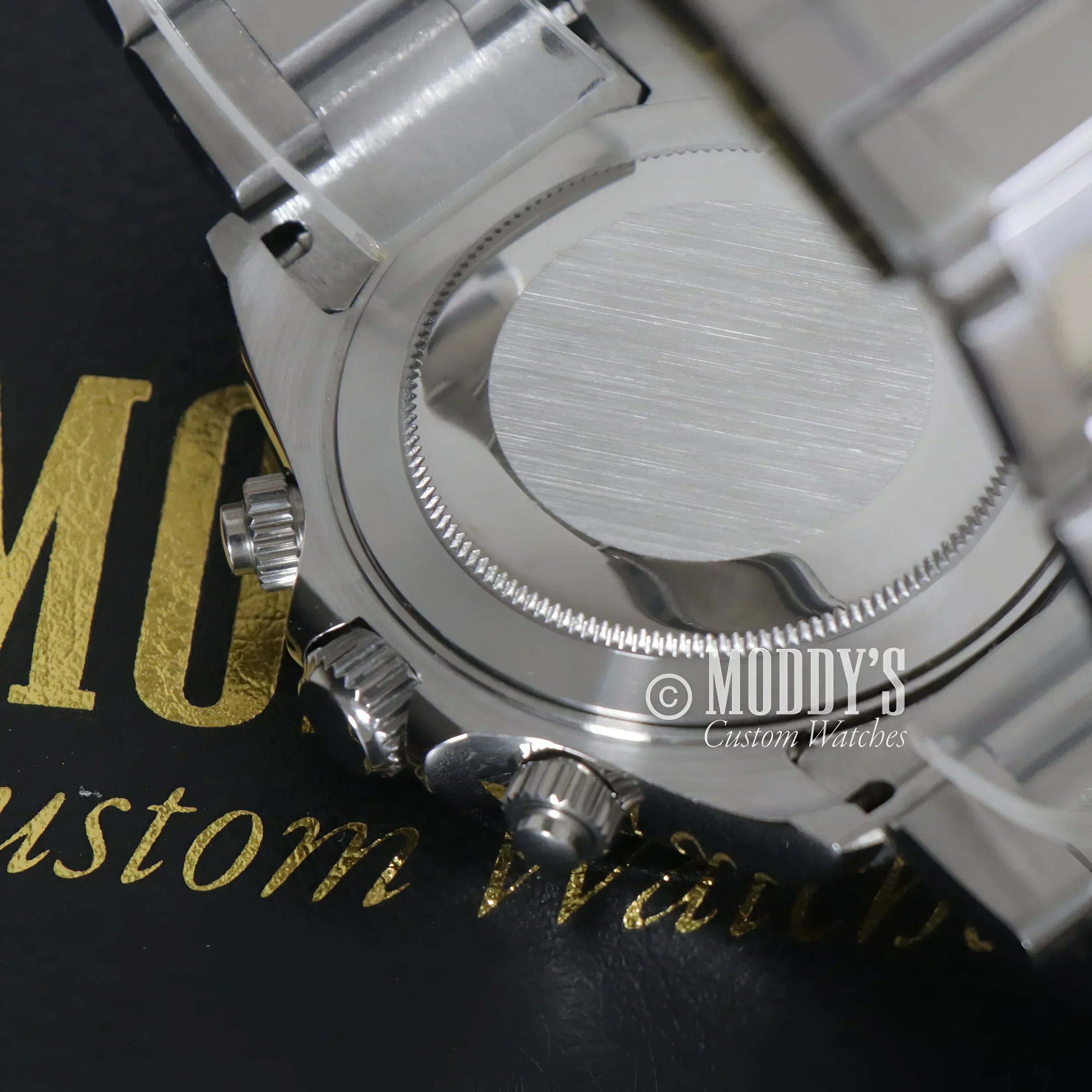 Silver wristwatch back of Seitona with Seiko VK63 hybrid movement showcased