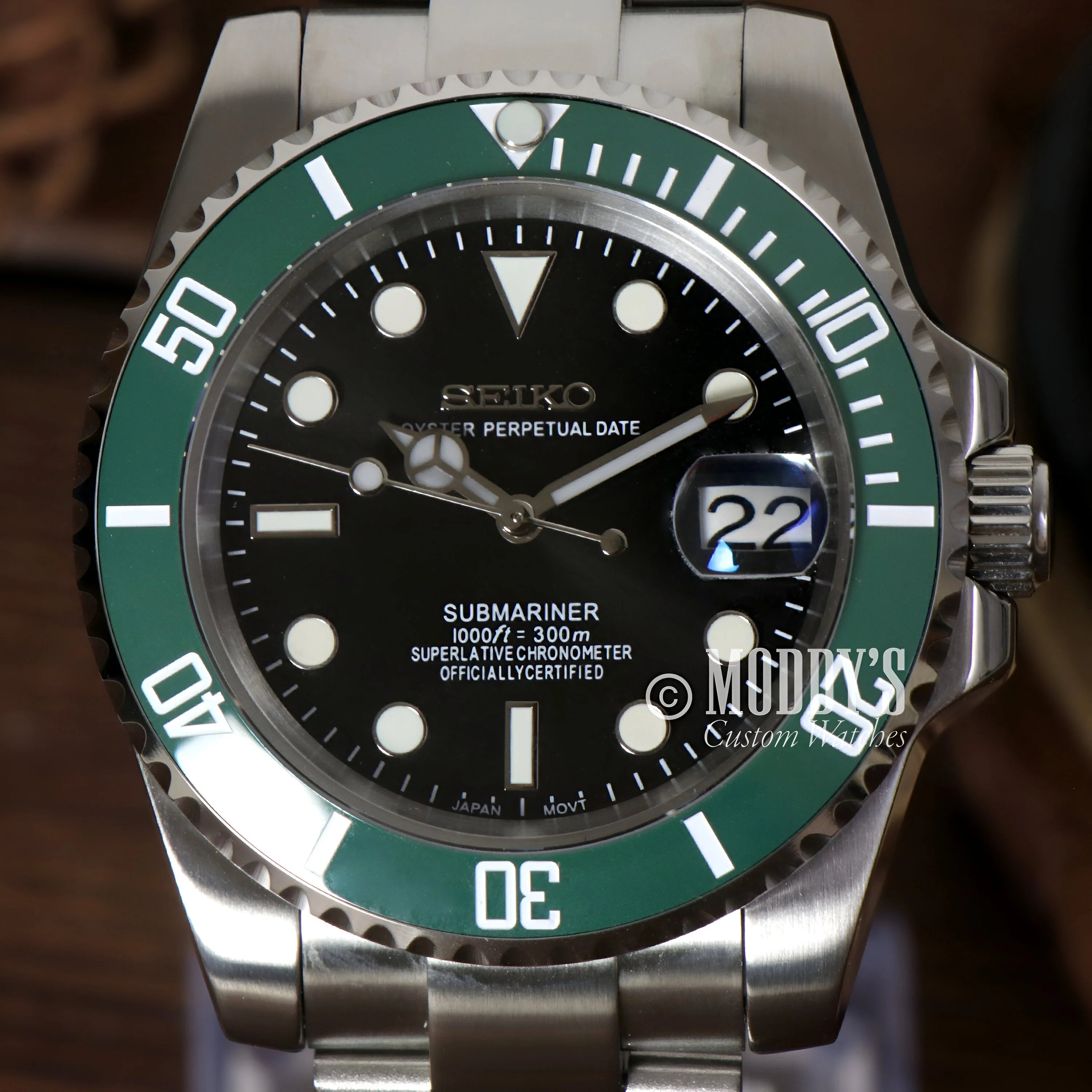 Rolex Submariner watch with green bezel and black dial in Seikomariner Kermit case